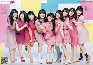 A group of young women in pink dresses posing for a magazine.