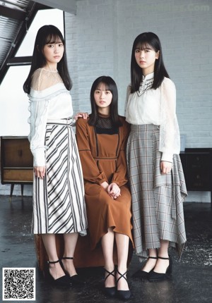 A group of young women standing next to each other on a magazine cover.