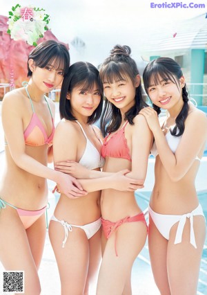 A group of young women in a swimming pool.