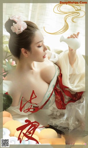 A woman in a white dress laying on a bed.