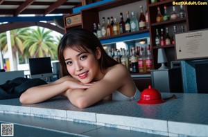 A woman in a black lingerie sitting on a brown chair.