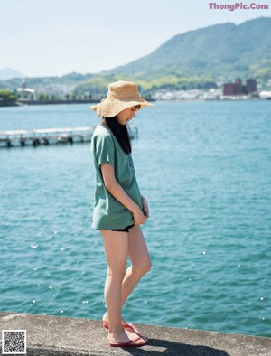 A woman sitting in a boat on the water.