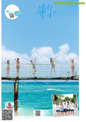 A group of women in bikinis posing on a pier.