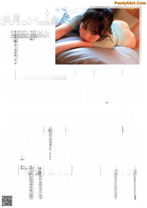 A woman sitting on top of a bed next to a window.