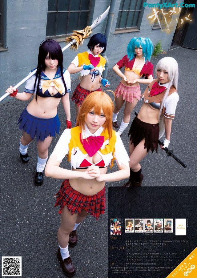 A group of girls dressed in school uniforms posing for a picture.