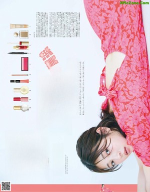 A woman in a white hat is posing for a magazine.